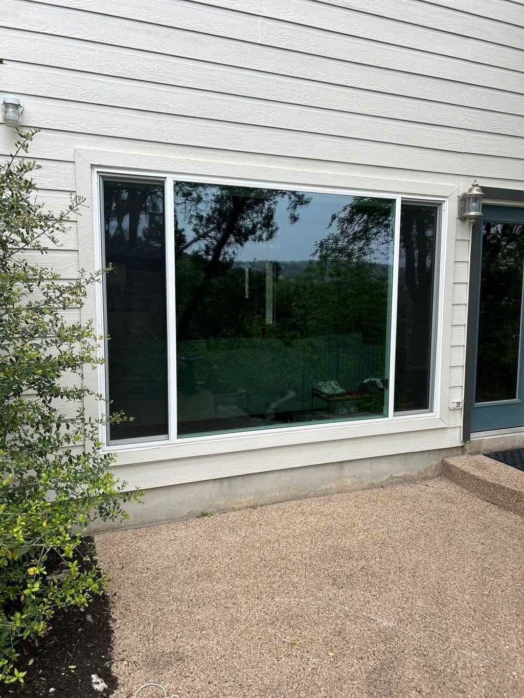 Anlin 3-panel end-vent slider window white frame after installation on Austin TX home by Glacier Home Exteriors