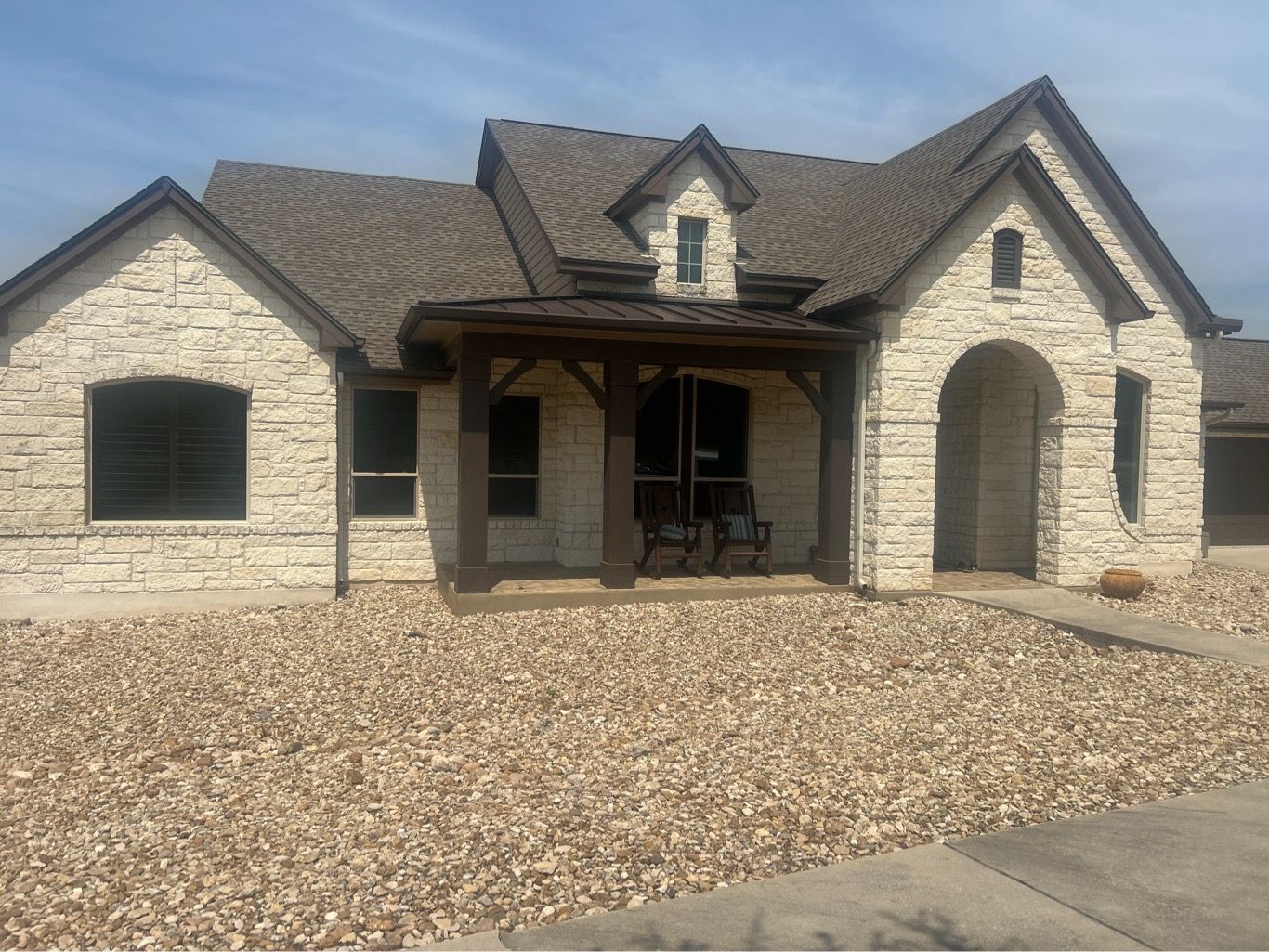 Anlin Panoramic windows Adobe color frame after installation stone Hill Country home Dripping Springs TX by Glacier Home Exteriors